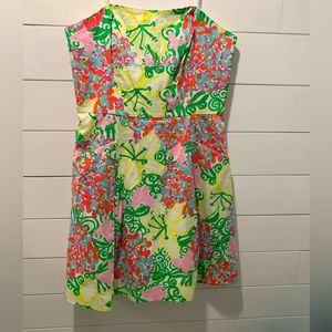Lily Pulitzer, strapless cotton dress w/ pockets. Lily and butterflies pattern.